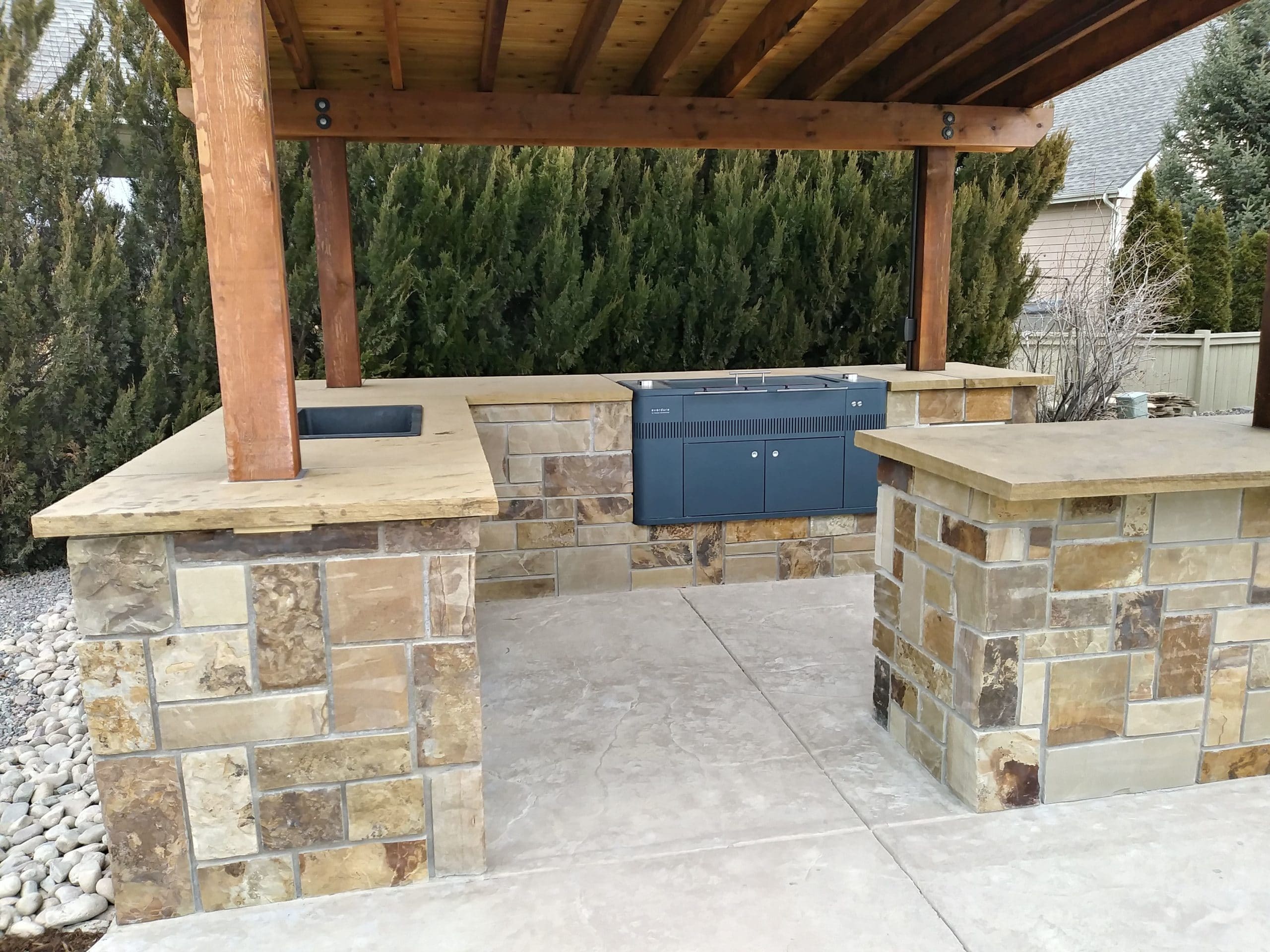 Outdoor Kitchen with patio and outdoor seating and eating area.