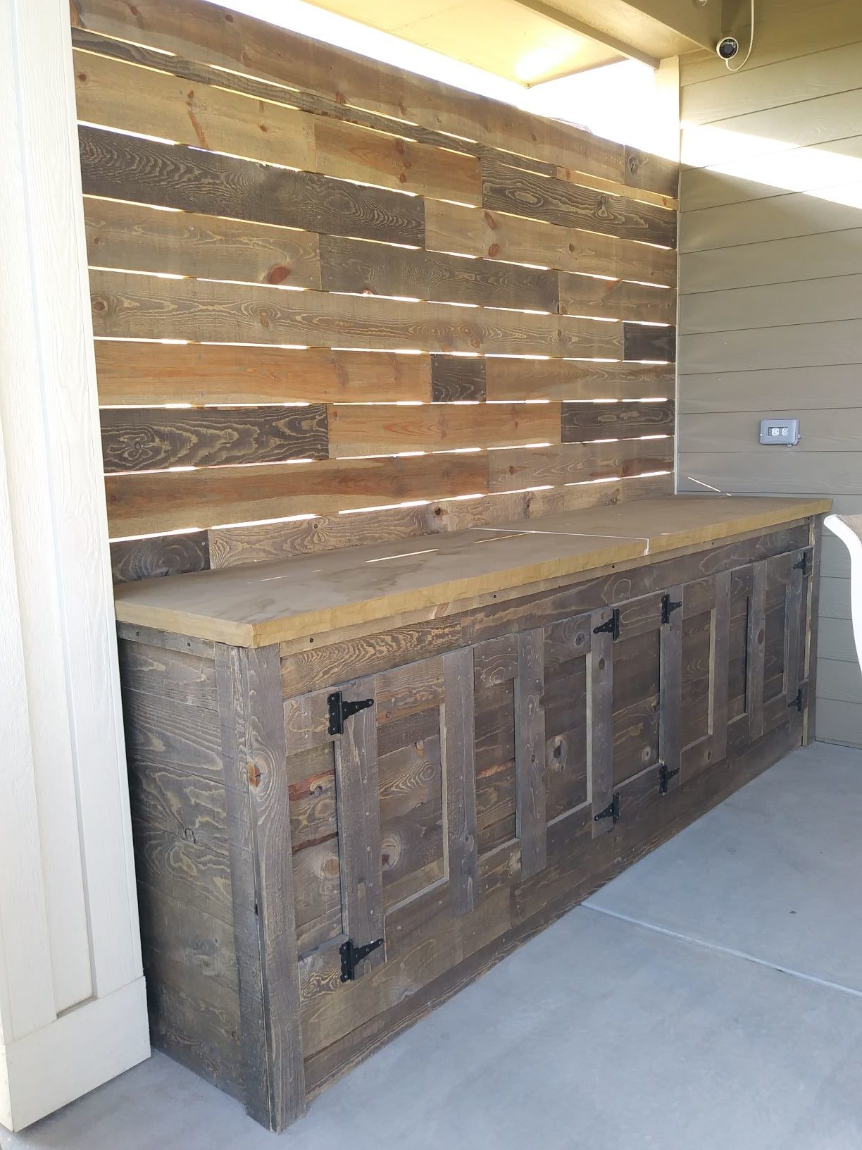Built in cabinet and counter on back patio.