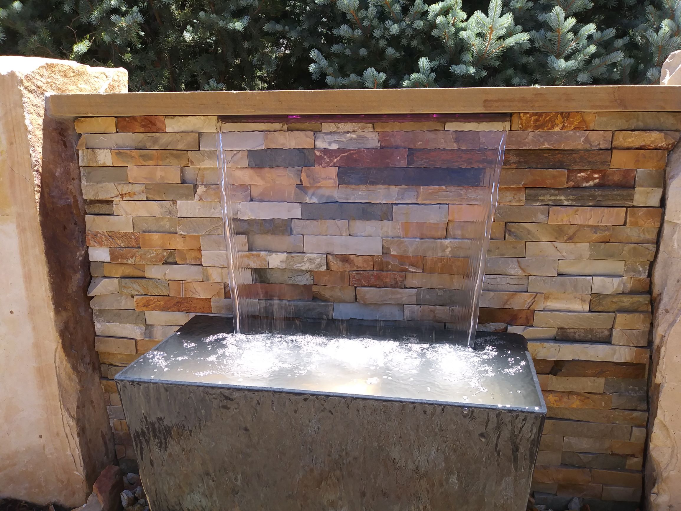 Small water feature set in stone.